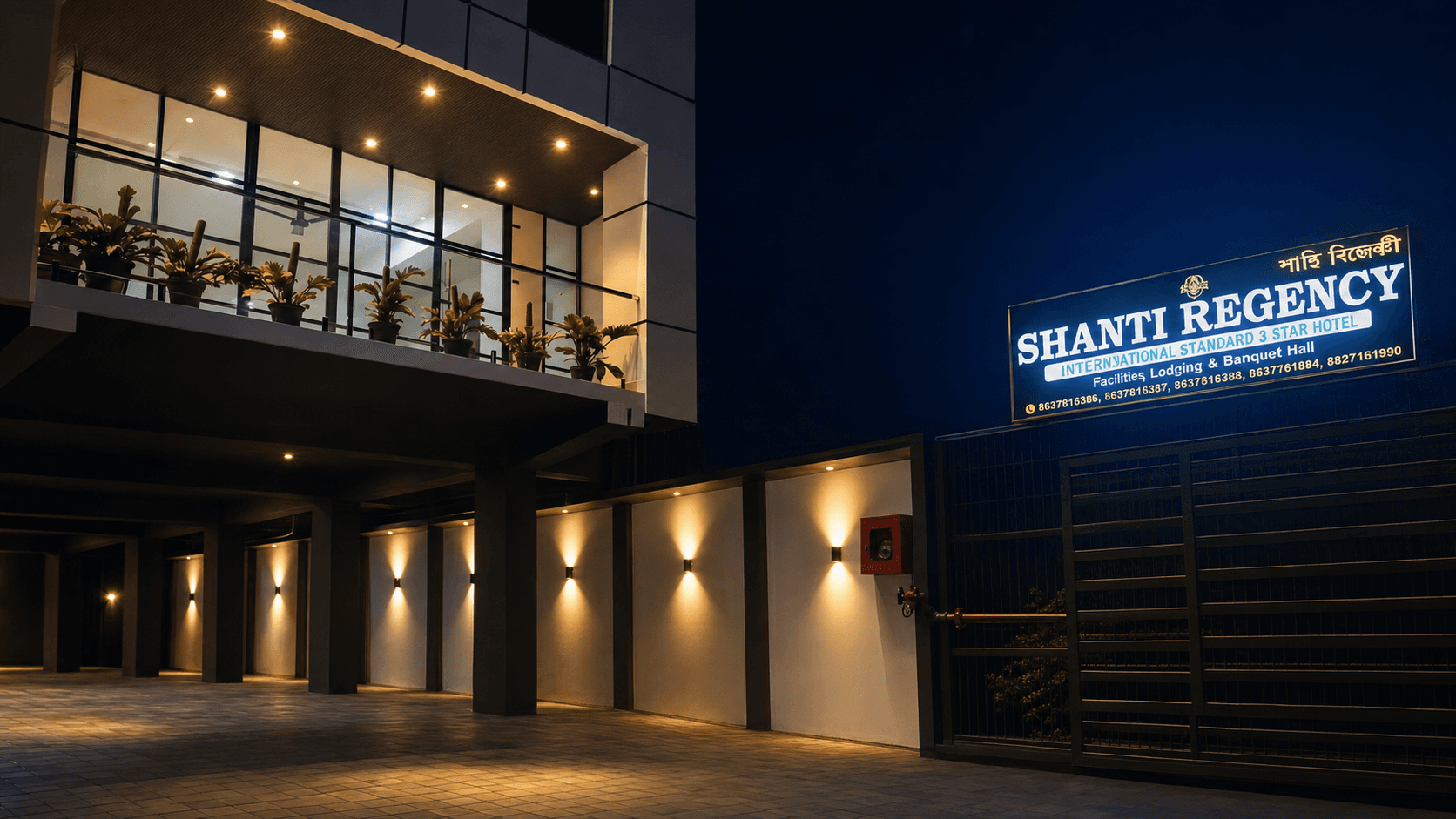 Shanti Regency entrance and illuminated exterior in the evening